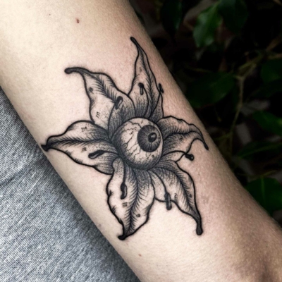 Flower with eye tattoo as a first tattoo for my client