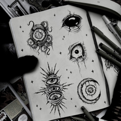 Pen drawings of differnt kind of eyes as tattoo designs.