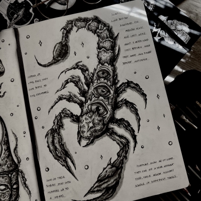 Scorpio drawing in a sketchbook