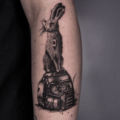 Rabbit on a cyberpunk helmet arm tattoo